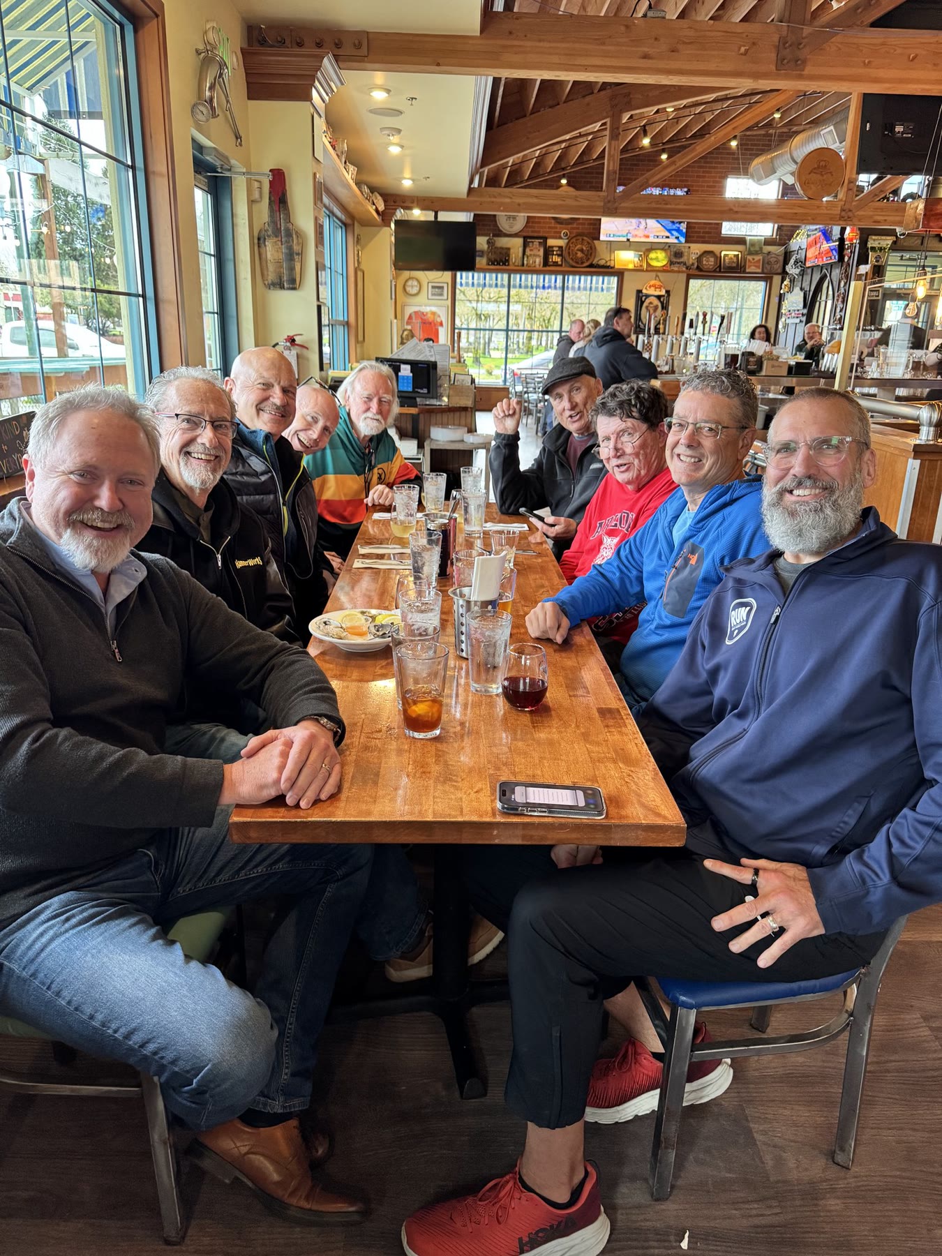 Friends gathered around a restaurant table in Olympia, Washington