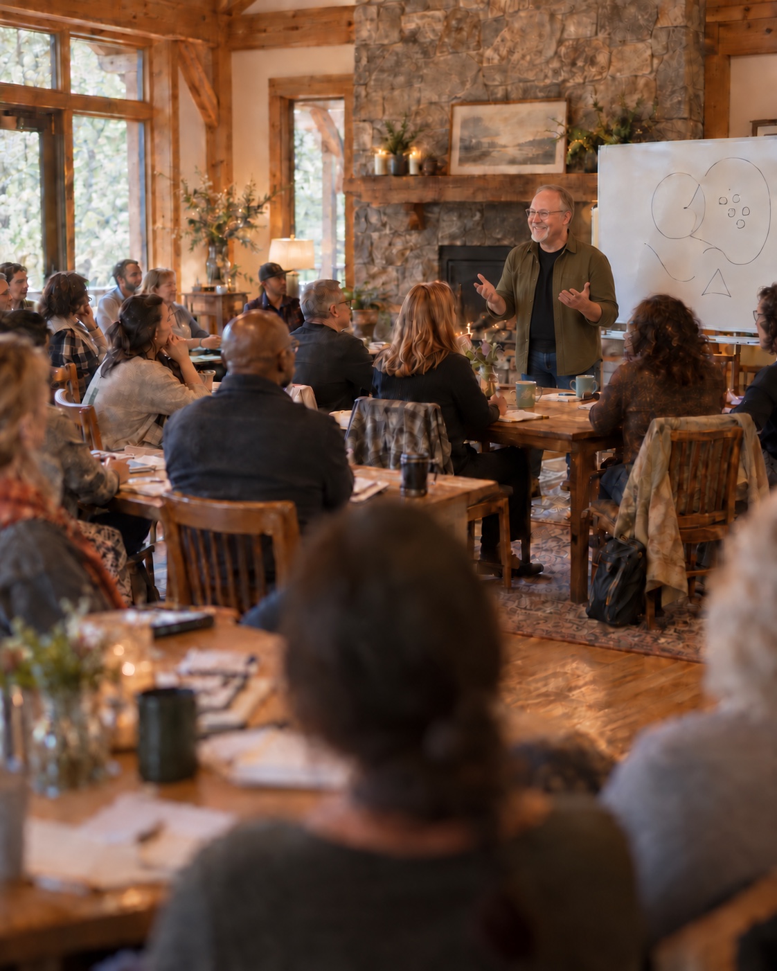 A Reorient Your Life Workshop gathered around tables